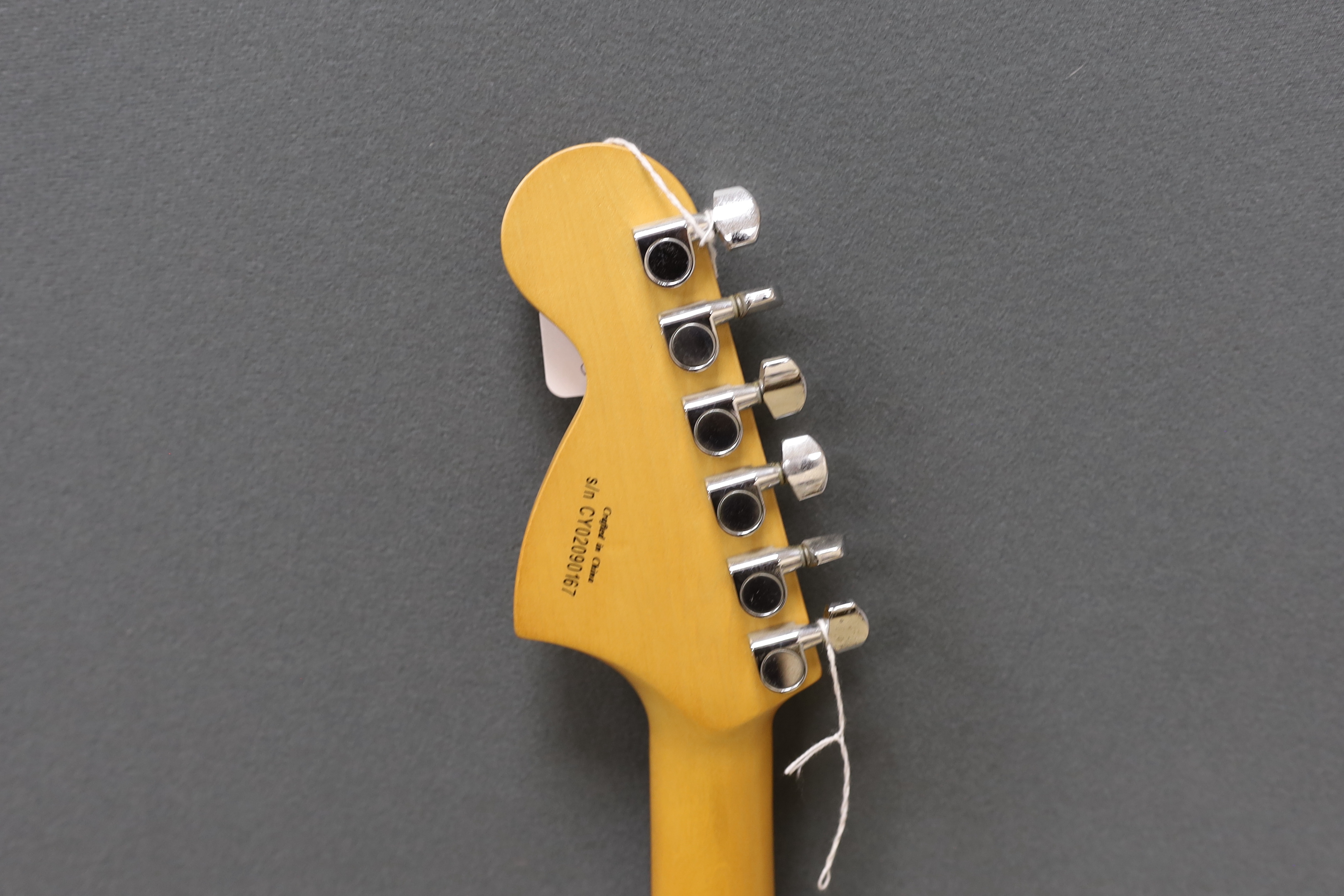 A Fender Squier 20th anniversary electric guitar with soft case